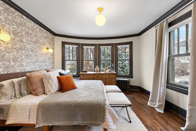 bedroom with multiple windows, ornamental molding, and dark wood-type flooring