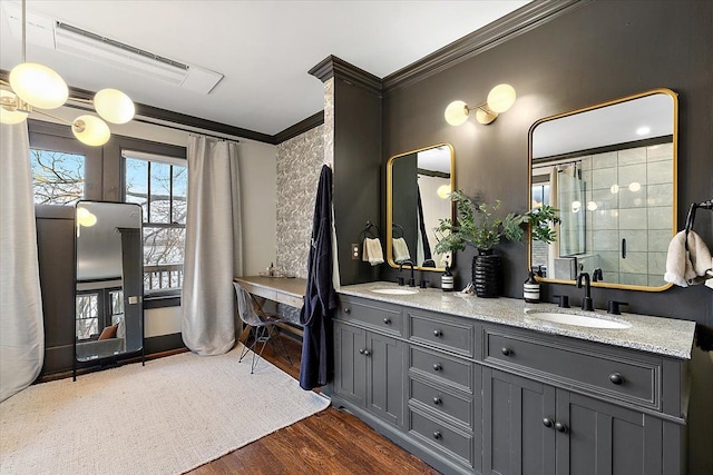 bathroom featuring an enclosed shower, ornamental molding, vanity, and hardwood / wood-style floors