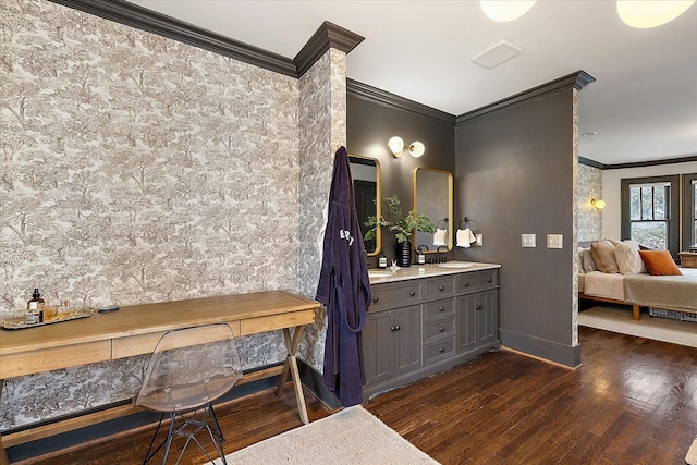 bathroom featuring vanity, crown molding, and hardwood / wood-style floors