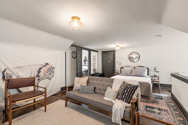 bedroom with hardwood / wood-style floors