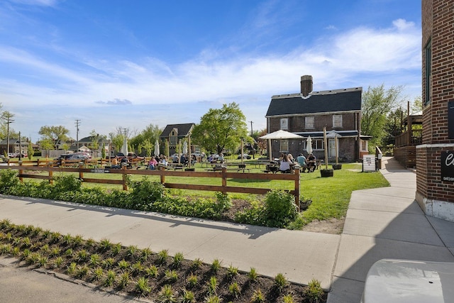 view of property's community with a lawn