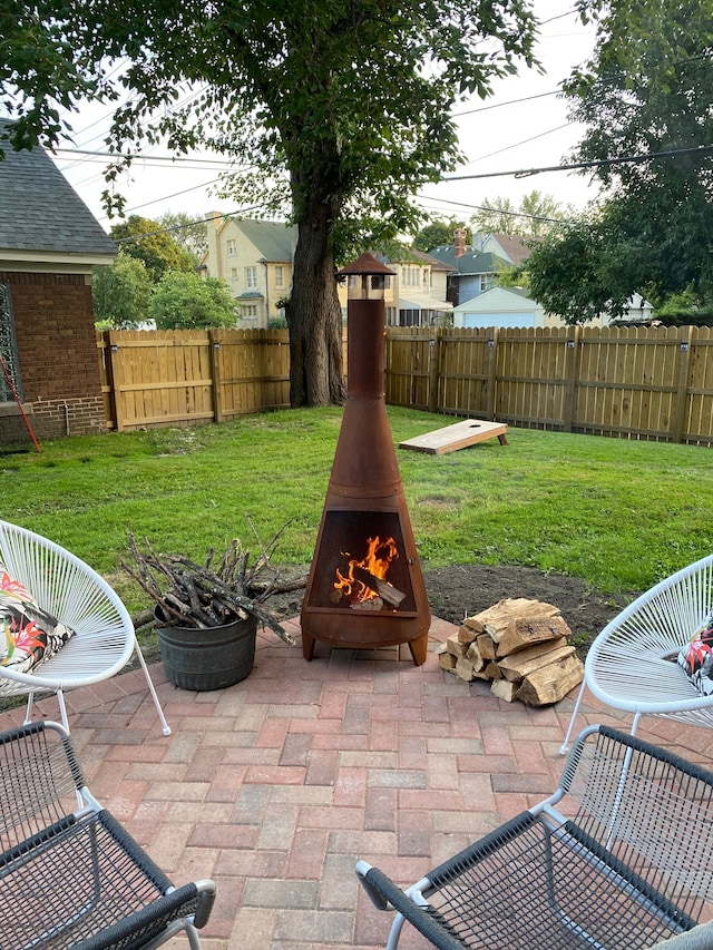 view of patio with a fire pit