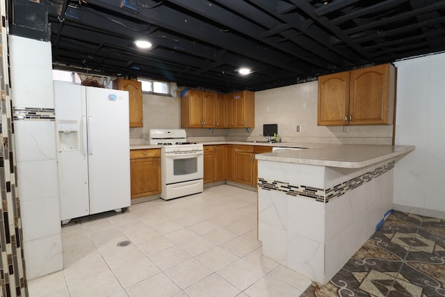 kitchen with kitchen peninsula, white appliances, light tile patterned flooring, and sink