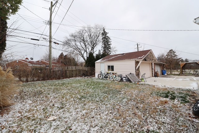 view of property exterior featuring an outdoor structure and a garage