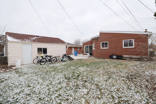 back of property with a patio area