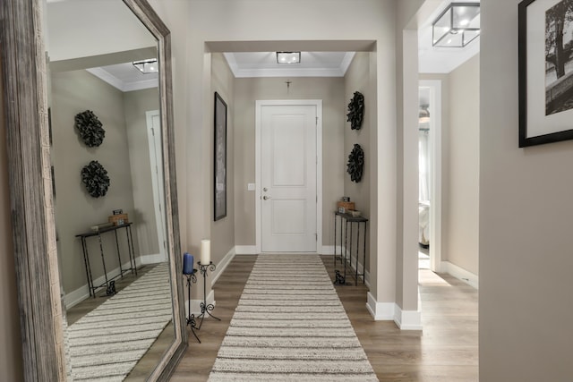 interior space featuring hardwood / wood-style flooring and ornamental molding