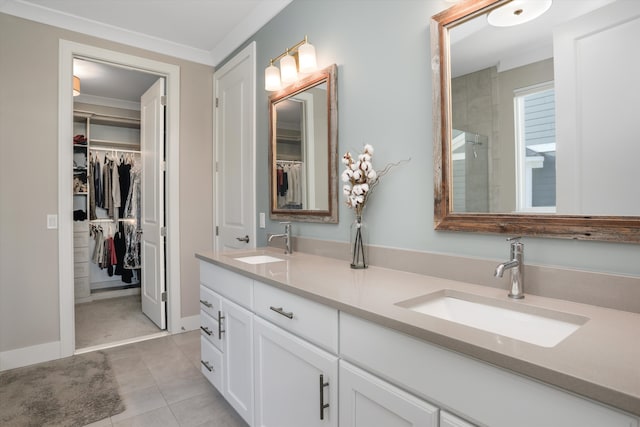 bathroom featuring tile patterned floors, vanity, and ornamental molding