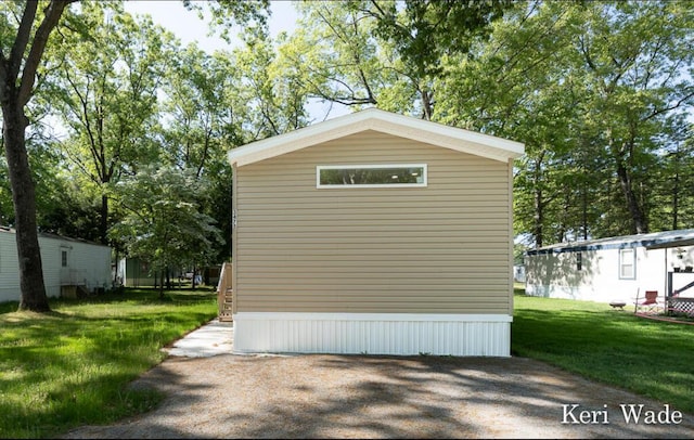 view of side of property featuring a yard