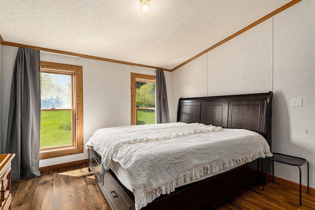 bedroom featuring a textured ceiling, crown molding, multiple windows, and dark wood-type flooring
