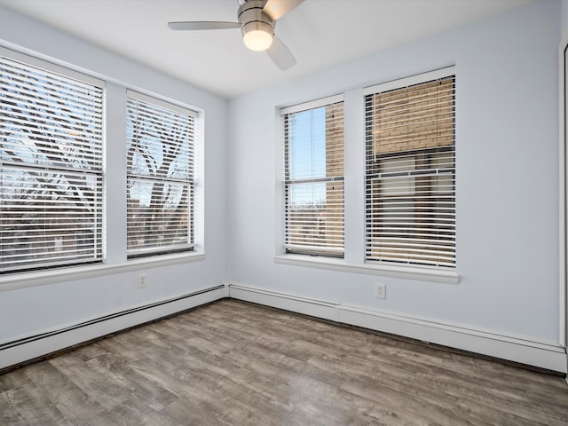 empty room featuring hardwood / wood-style floors and ceiling fan