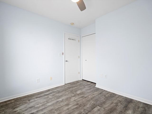 spare room featuring hardwood / wood-style flooring and ceiling fan