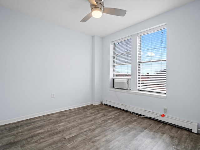 spare room featuring hardwood / wood-style floors, a baseboard radiator, and ceiling fan