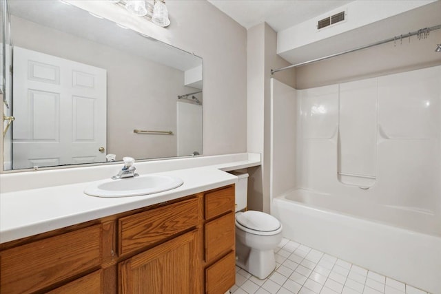 full bathroom featuring tile patterned floors, washtub / shower combination, vanity, and toilet