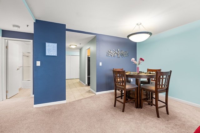 view of carpeted dining space