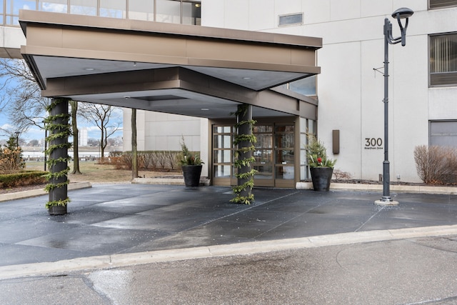 exterior space with a carport