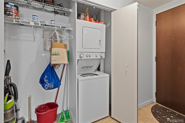 1001 W Jefferson Ave Unit 10E, Detroit, MI 48226 - washroom with stacked washer / dryer and light tile patterned flooring