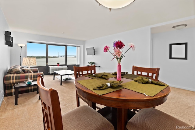 1001 W Jefferson Ave Unit 10E, Detroit, MI 48226 - dining room with light carpet and baseboards