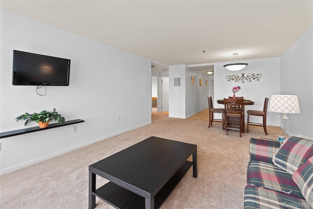1001 W Jefferson Ave Unit 10E, Detroit, MI 48226 - living room featuring light carpet and baseboards