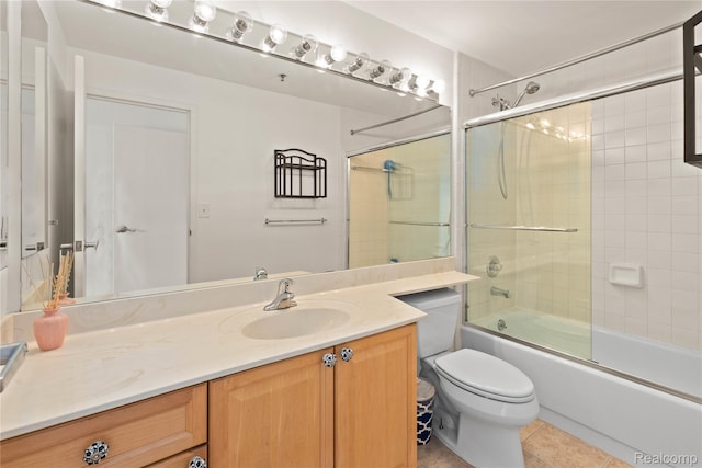 1001 W Jefferson Ave Unit 10E, Detroit, MI 48226 - full bathroom with vanity, toilet, combined bath / shower with glass door, and tile patterned flooring