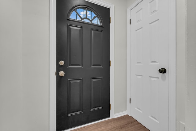 entryway with dark wood-type flooring