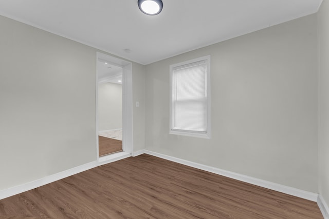 unfurnished room featuring hardwood / wood-style flooring