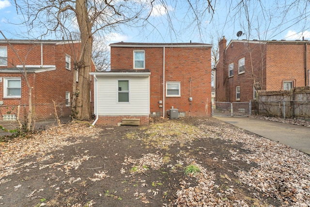 rear view of property with cooling unit