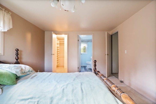 bedroom with carpet and connected bathroom