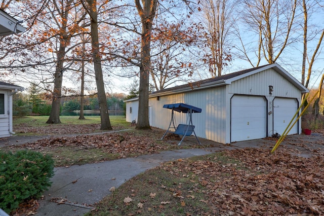 exterior space with a garage and an outdoor structure