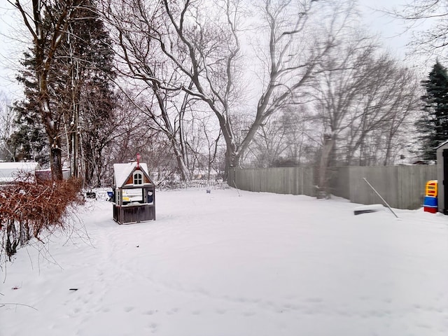 view of yard layered in snow