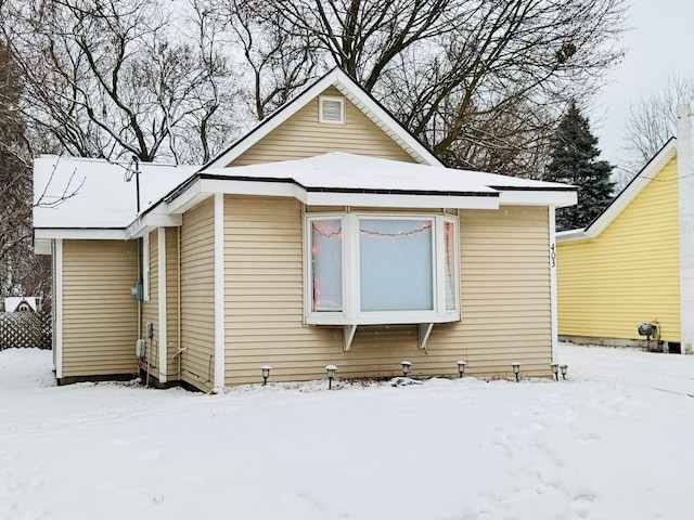 view of snow covered house