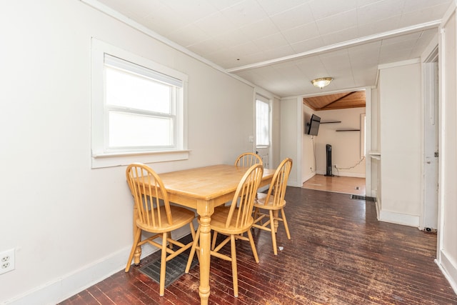 dining space with dark hardwood / wood-style floors