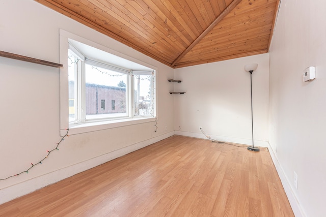 unfurnished room featuring light hardwood / wood-style flooring, lofted ceiling, and wood ceiling