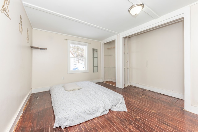 bedroom featuring a closet and dark hardwood / wood-style flooring