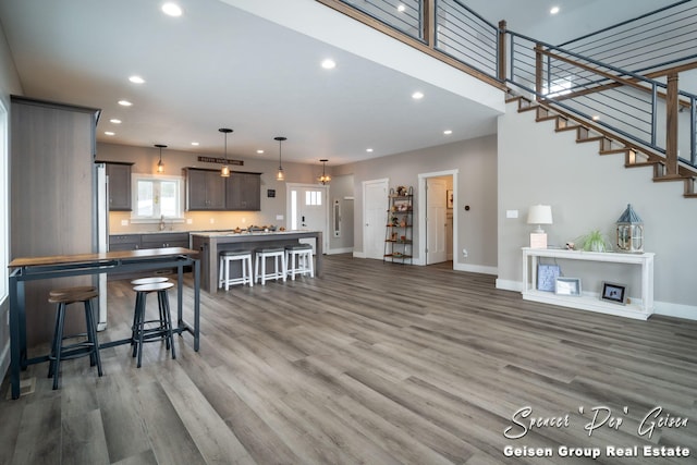 living room with sink and hardwood / wood-style flooring