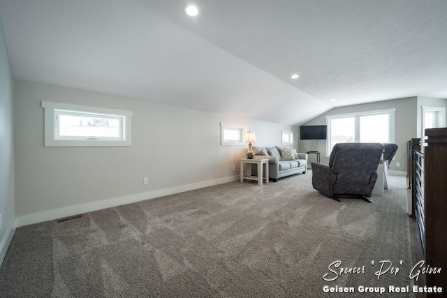 unfurnished room with carpet floors and lofted ceiling