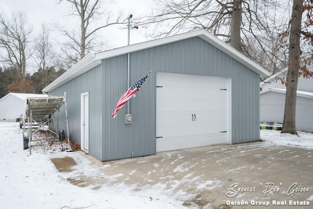 view of snow covered garage