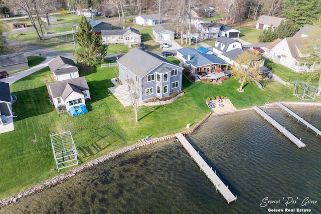 aerial view with a residential view and a water view