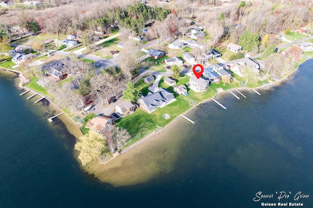 drone / aerial view featuring a residential view and a water view