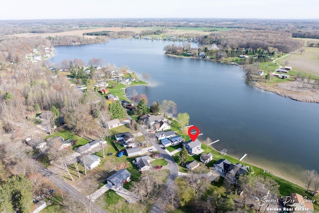 drone / aerial view with a water view and a residential view