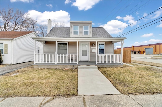 bungalow-style house with a porch and a front yard