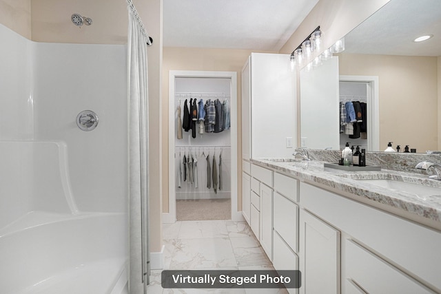2519 Hunters Run Unit 101, Kalamazoo, MI 49048 - bathroom featuring a shower and vanity