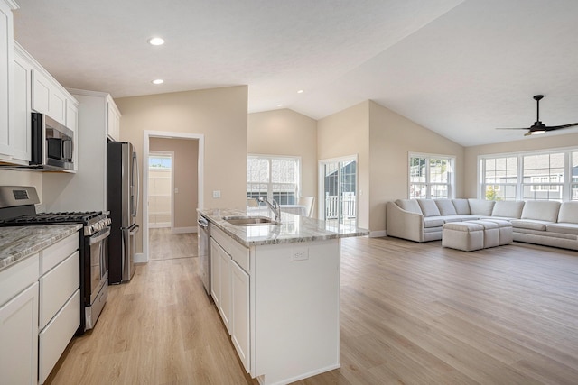 2519 Hunters Run Unit 101, Kalamazoo, MI 49048 - kitchen featuring sink, white cabinetry, a kitchen island with sink, and appliances with stainless steel finishes