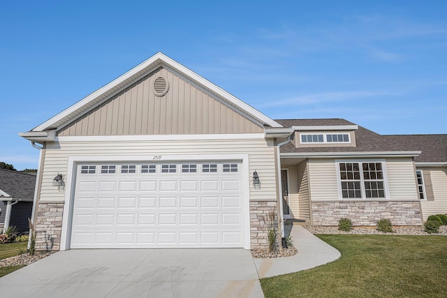 2519 Hunters Run Unit 101, Kalamazoo, MI 49048 - view of front facade featuring a front yard and a garage