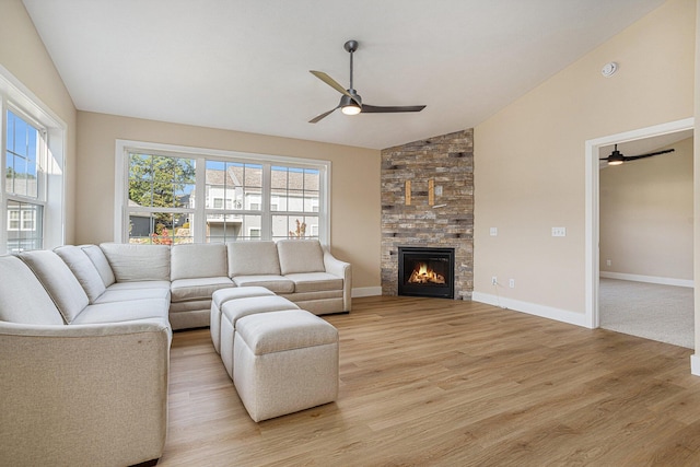 2519 Hunters Run Unit 101, Kalamazoo, MI 49048 - living room featuring ceiling fan, a fireplace, lofted ceiling, and light wood-type flooring