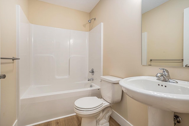 2519 Hunters Run Unit 101, Kalamazoo, MI 49048 - full bathroom featuring hardwood / wood-style flooring, sink, toilet, and shower / bathing tub combination