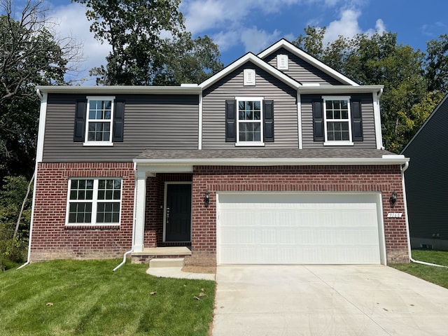 view of front facade with a garage and a front lawn