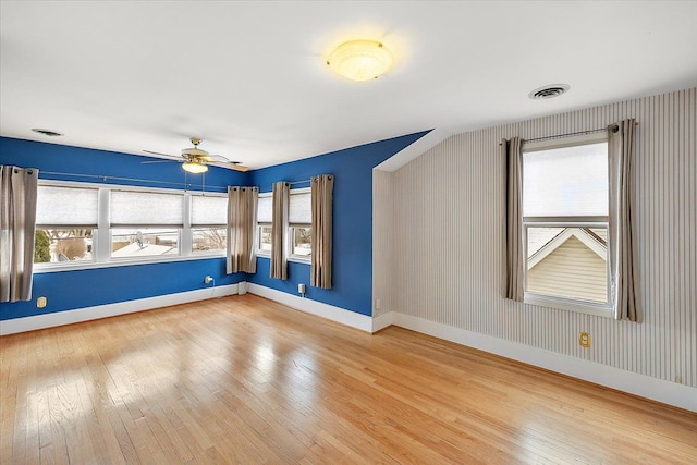 spare room featuring ceiling fan and wood-type flooring