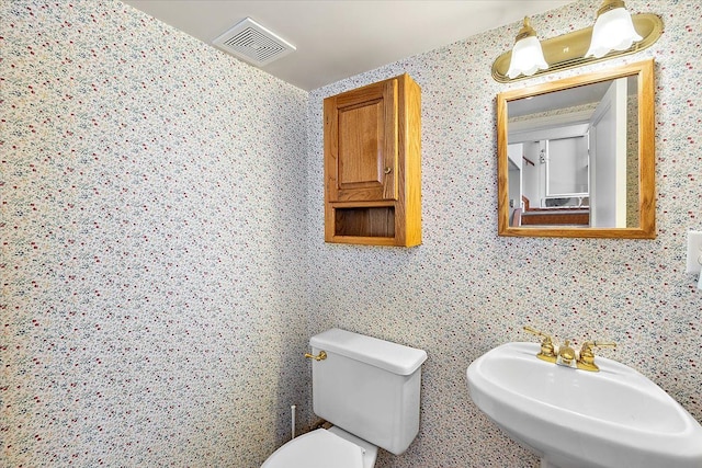 bathroom with sink and toilet