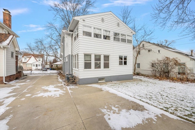 view of snow covered house