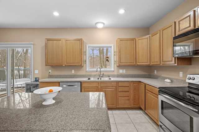 3700 Marie Meadows Dr, White Lake, MI 48383 - kitchen with appliances with stainless steel finishes, a sink, light brown cabinetry, light tile patterned floors, and recessed lighting